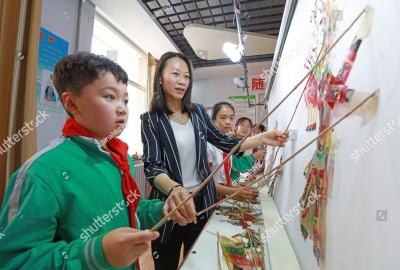 stock-photo-luannan-county-may-students-are-learning-chinese-traditional-shadow-play-manipulation-1469540960
